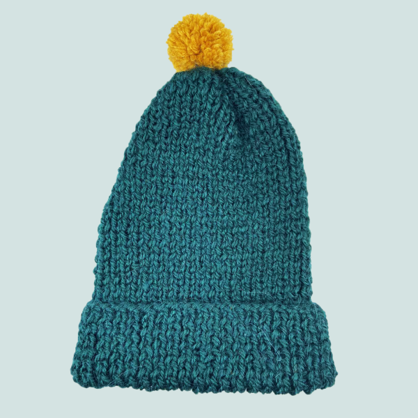 Green hat with yellow pompom